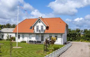 a white house with an orange roof at 3 Bedroom Gorgeous Apartment In Højer in Højer +9 photos