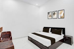 Ένα ή περισσότερα κρεβάτια σε δωμάτιο στο Hotel O X MART