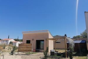 a small house in the middle of a desert at Gite avec piscine in Crespian +6 photos