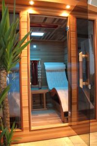a sauna with a bench inside of a room at Alpenchalet Gosau in Gosau