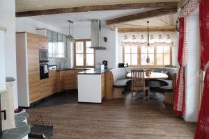 a kitchen with a table and a counter top at Alpenchalet Gosau in Gosau