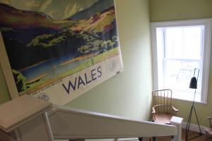 a wall with a large poster on the wall at The Tilman in Barmouth