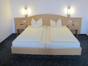 Postel nebo postele na pokoji v ubytování Hotel Jagermo