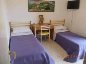 Кровать или кровати в номере Sferracavallo Apartments