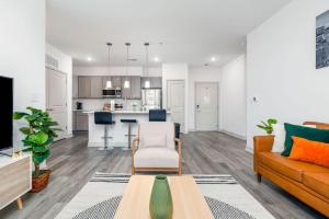 a living room with a couch and a table at Affordable 2-Bedroom Whitestown in Whitestown +35 photos
