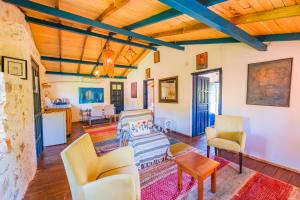 a living room filled with furniture and a wooden ceiling at Amara Nature Homes in Kaş