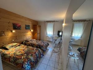 Postel nebo postele na pokoji v ubytování Abel Hôtel