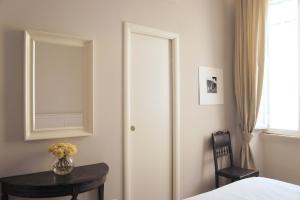 Postel nebo postele na pokoji v ubytování Roman Suite