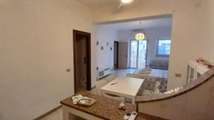 a living room with a table and a dining room at A 2 passi dalla piazza in Ustica +58 photos