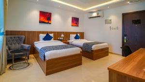 Duqm Express Hotel客房内的一张或多张床位