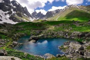 a mountain lake in the middle of a valley at MOUNTAIN HOUSE In ROSHKA in Roshka