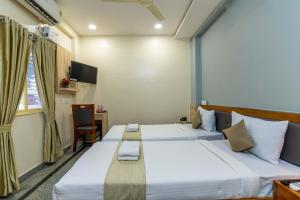 Hotel Chalet, Madiwala客房内的一张或多张床位