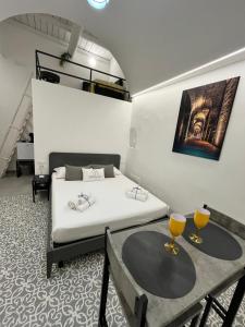 Letto o letti in una camera di Cisternone Suites