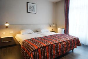 Voodi või voodid majutusasutuse Hotel Prins Boudewijn toas