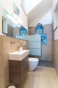 a bathroom with a sink and a toilet at Mare Luna - Enchanting sea view apartment in Ravello +32 photos