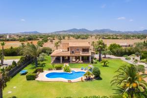 an aerial view of a house with a swimming pool at S'hort, espectacular villa en el paraíso in Calonge