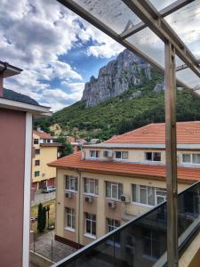 a view from the balcony of a building with a mountain at Апартамент Светли in Vratsa