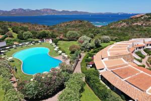 an aerial view of a resort with a swimming pool at Capo Ceraso Family Resort in Costa Corallina