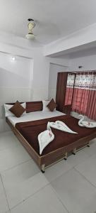 Postel nebo postele na pokoji v ubytování Hotel Dev Lakeview