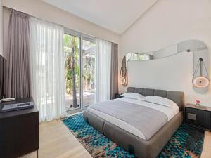 Postel nebo postele na pokoji v ubytování Biblos Resort Alaçatı