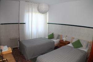 Posteľ alebo postele v izbe v ubytovaní Casa La Madriguera