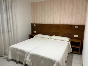 Łóżko lub łóżka w pokoju w obiekcie Casa Fuentes