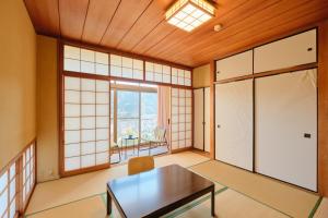an empty room with a table and a window at Suikouen / Vacation STAY 51966 in Mongawa +90 photos