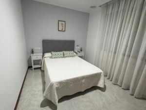 Łóżko lub łóżka w pokoju w obiekcie Casa Fuentes