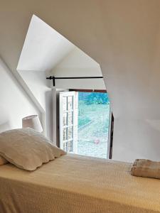 Postel nebo postele na pokoji v ubytování A l'ombre du château, Dépendance de caractère