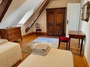 Postel nebo postele na pokoji v ubytování A l'ombre du château, Dépendance de caractère
