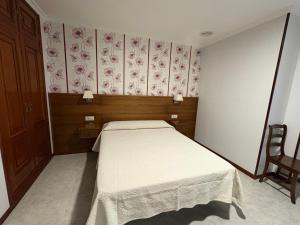 Łóżko lub łóżka w pokoju w obiekcie Casa Fuentes
