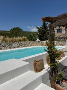The swimming pool at or close to Masía La Costereta