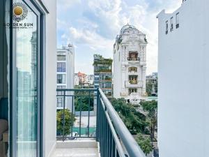 a balcony with a view of a building at Golden Sun Hotel Apartments 5 in Ho Chi Minh City