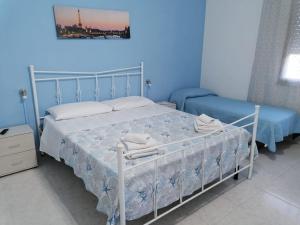Postel nebo postele na pokoji v ubytování Casa BiaBella