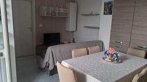 a kitchen with a table and a dining room at Giaro's Home in Pompei