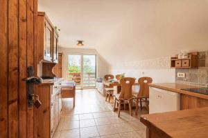 a kitchen with a table and a dining room at Holiday home in Novo Mesto - Dolenjska Bela krajina Unter- Weißkrain 35158 in Novo Mesto +20 photos