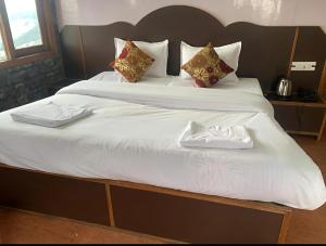 Voodi või voodid majutusasutuse Hotel Sita - The Family choice toas