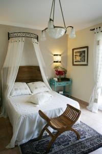 En eller flere senger på et rom på Villa Mimosa