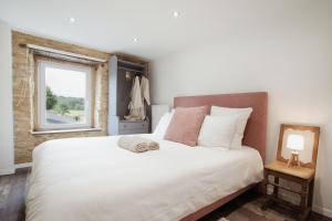 Una cama o camas en una habitación de Gîte Saint-Roch