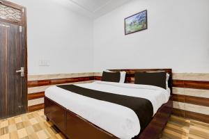 Postel nebo postele na pokoji v ubytování Hotel O Ekant Guest House