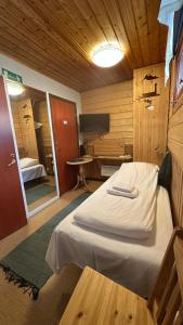 Postel nebo postele na pokoji v ubytování Lumi Guest House