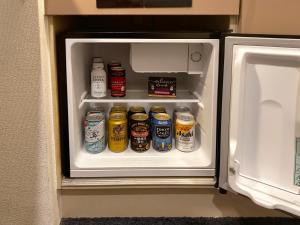 an open refrigerator filled with lots of drinks at ZONK HOTEL Nakasu in Fukuoka