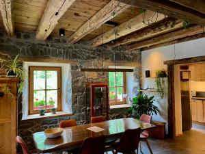 a dining room with a table and chairs at Casa Alice in Rocca Pietore