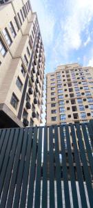 two tall buildings standing next to each other at Luxury new apartment in the downtown in Bishkek