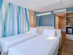 Cama o camas de una habitación en Mercure Rio de Janeiro Barra da Tijuca