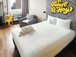 Postel nebo postele na pokoji v ubytování ibis styles Lima San Isidro