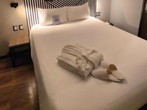 Postel nebo postele na pokoji v ubytování ibis styles Lima San Isidro