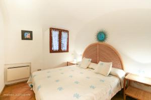 Кровать или кровати в номере Porto Cervo House, giardino e piscina condominiale +16 фотографий