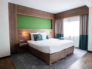Ibis Styles Cayenne Centre Amazonia客房内的一张或多张床位