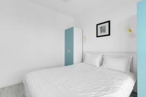 Ένα ή περισσότερα κρεβάτια σε δωμάτιο στο Cloud 9 Apartment